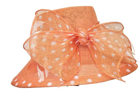 Orange hat with a large bow on a white background