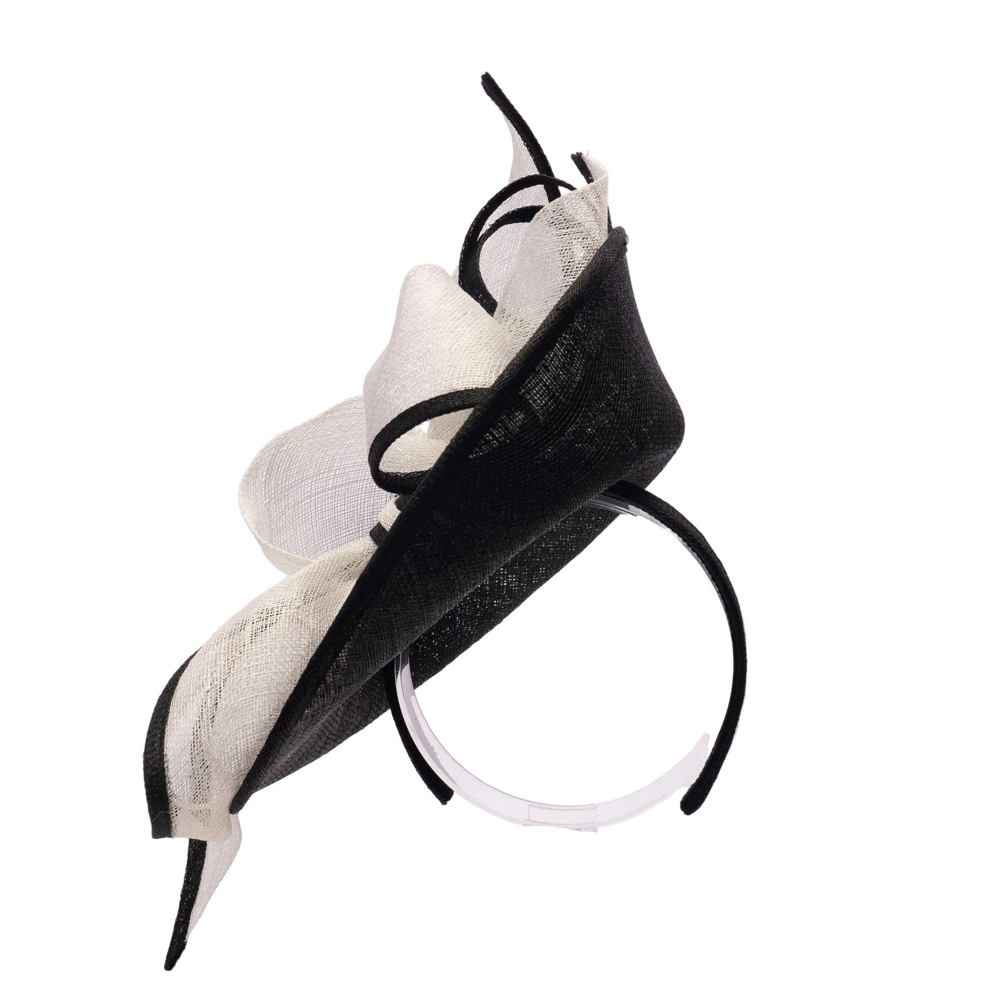 Black and white decorative headpiece on a stand against a light gray background