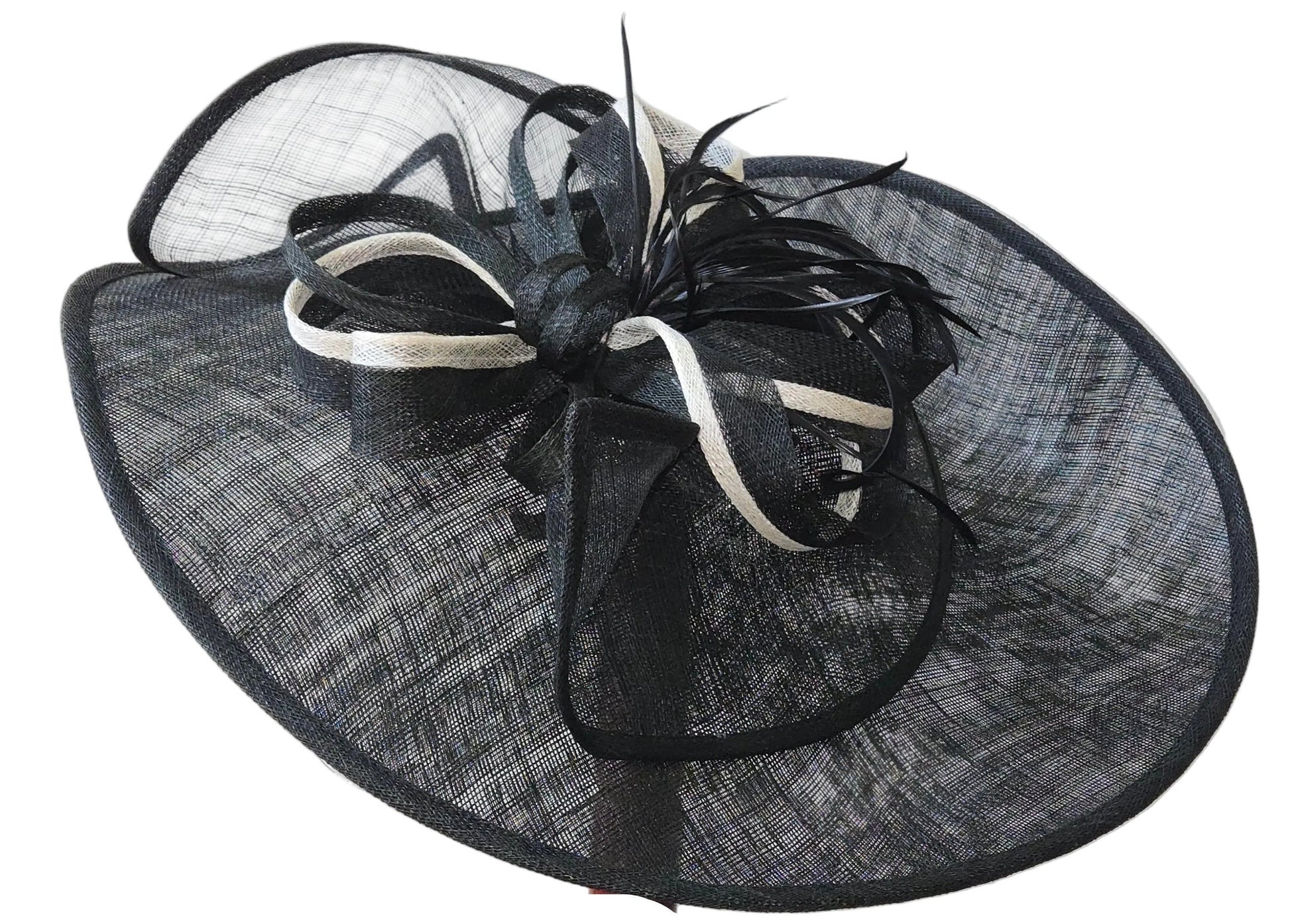 Black and white decorative hat with feather accents on a white background